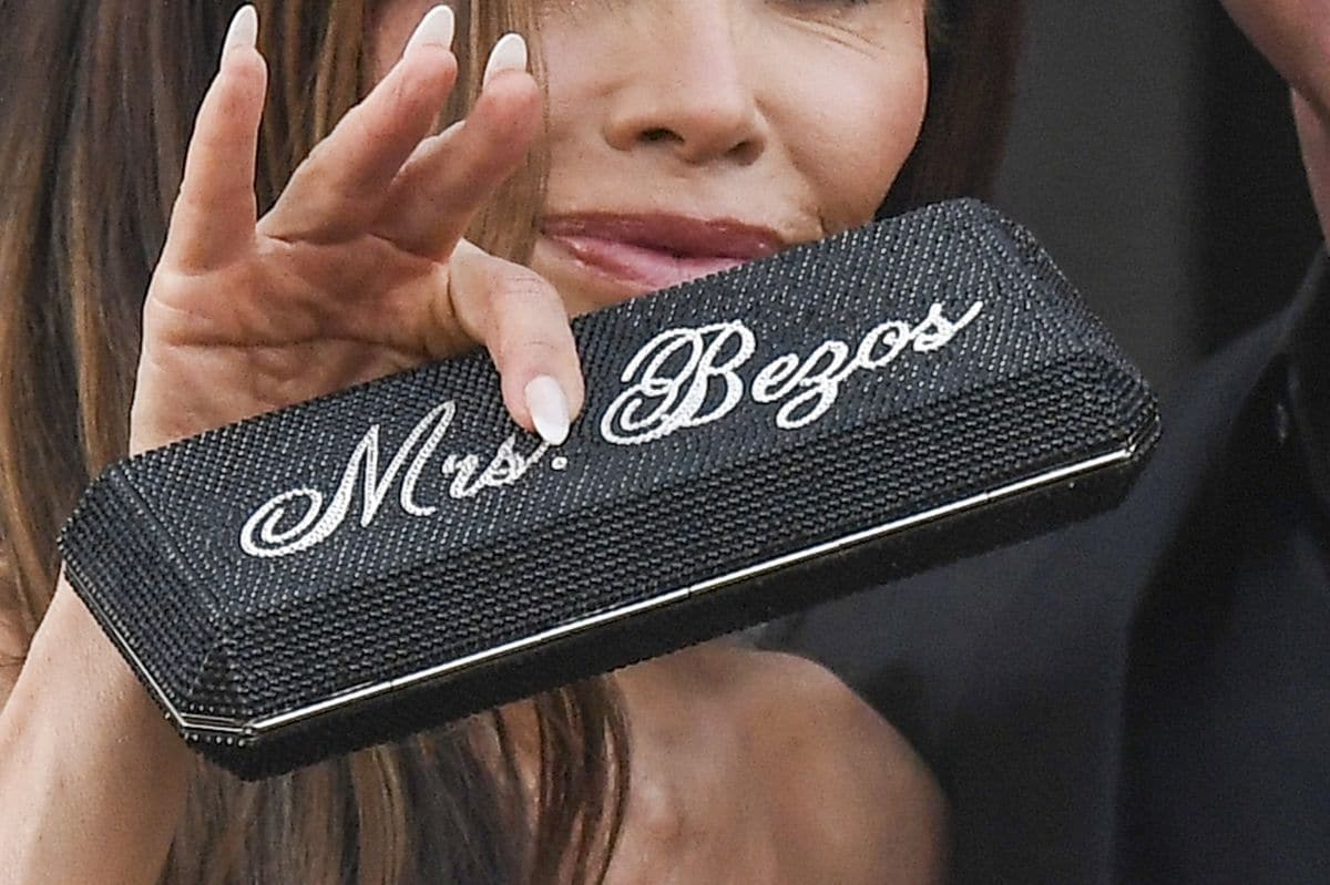 the exclusive clutch Lauren carried as she waved and stepped onto the gondola with the love of her life.