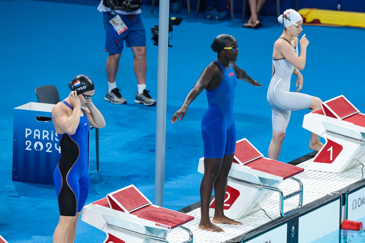 Ana Nizharadze (R) of Team Georgia, Oumy Diop (C) of Team Senegal and Luana Alonso (L) of Team Paraguay prepare to compete in the Women's 100m Butterfly Heats on day one of the Olympic Games Paris 2024 at Paris La Defense Arena on July 27, 2024 in Nanterre, France. (Photo by Jean Catuffe/Getty Images)