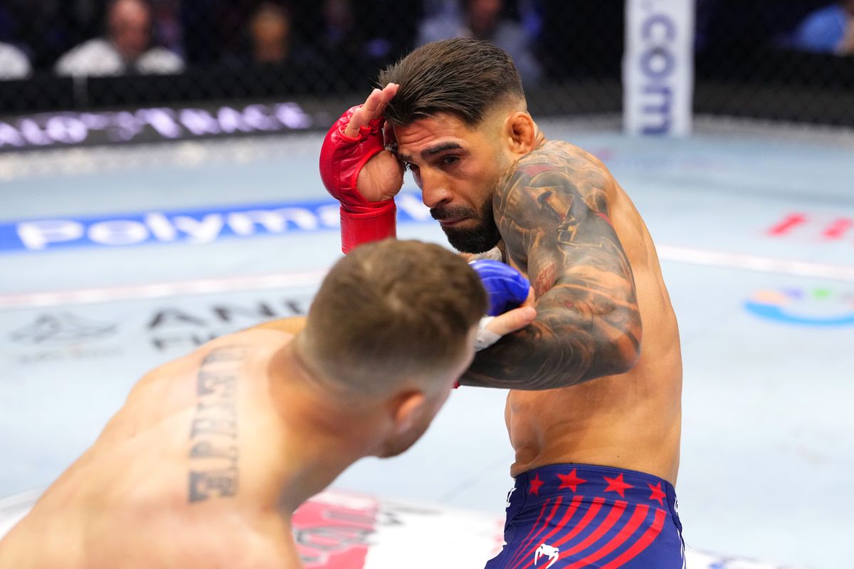 Topuria's face showed the effects of a punishing battle as the fight progressed into the later rounds.