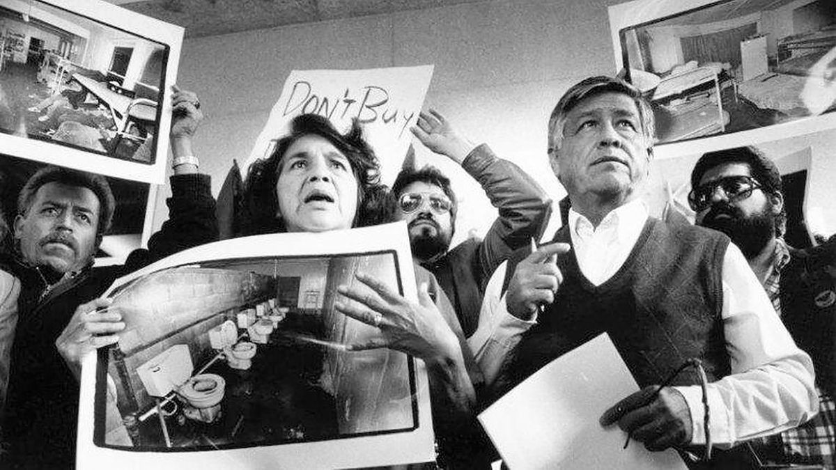 United Farm Workers leaders Dolores Huerta and Cesar Chavez display photos of the conditions that farmworkers endure in San Joaquin Valley farm labor camps at a news conference