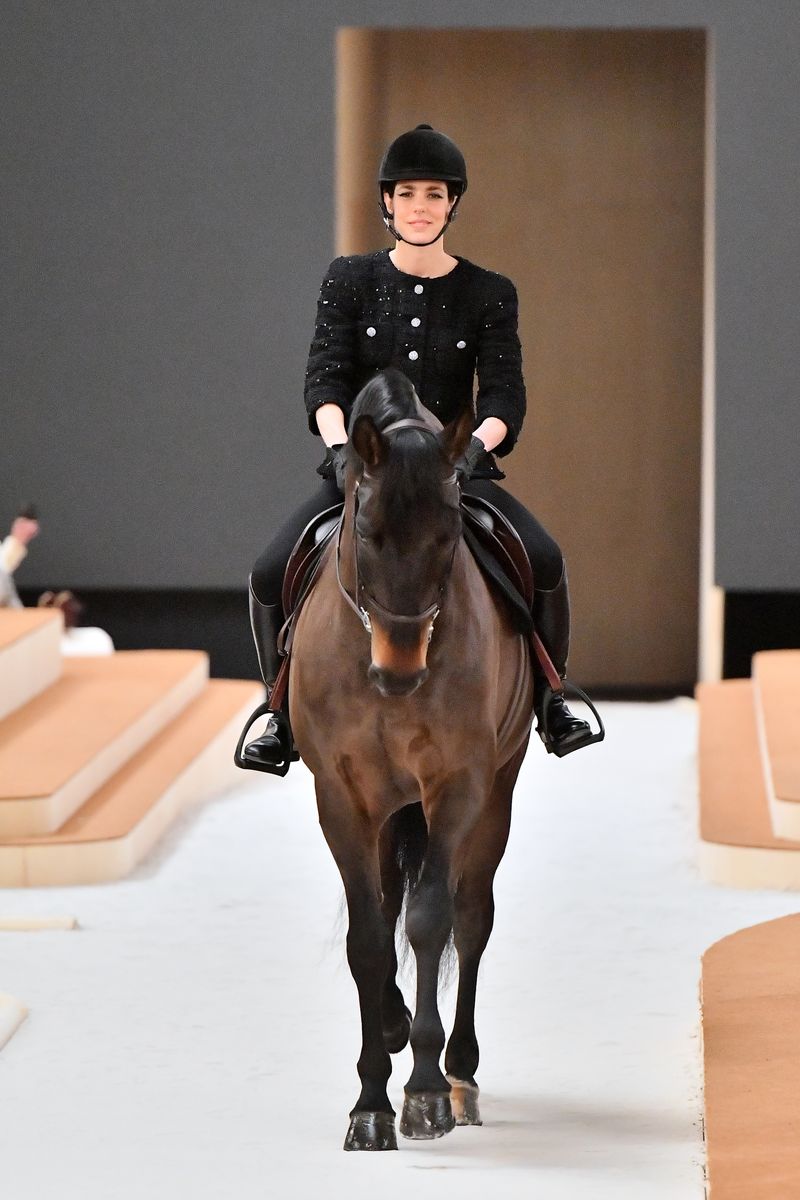 PARIS, FRANCE - JANUARY 25: (EDITORIAL USE ONLY - For Non-Editorial use please seek approval from Fashion House) Charlotte Casiraghi rides a horse on the runway during the Chanel Haute Couture Spring/Summer 2022 show as part of Paris Fashion Week at Le Grand Palais Ephemere on January 25, 2022 in Paris, France. (Photo by Dominique Charriau/WireImage)