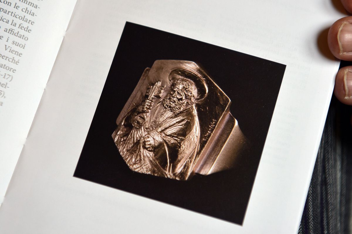 The Fishermanâ's Ring of Pope Francis is seen on the Vatican's guidebook for the inauguration mass on March 18, 2013, at the Vatican. Pope Francis eschewed tradition and chose a silver Fisherman's Ring rather than a gold one.