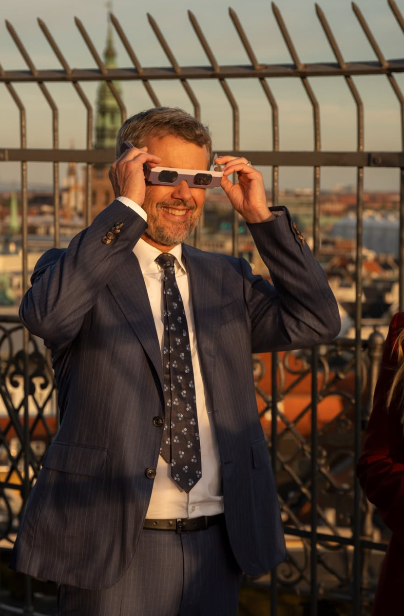 King Frederik wore protective glasses as he watched the celestial event from the Round Tower.