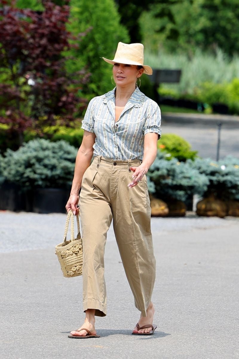 Jennifer Lopez exudes Hamptons chic as she steps out with her manager, Benny Medina, celebrating the Fourth of July by indulging in some plant shopping. The duo looked cheerful as they browsed through a variety of greenery and were seen hauling off about six rose bushes. Meanwhile, husband Ben Affleck was seen in LA enjoying some time with his kids. 
