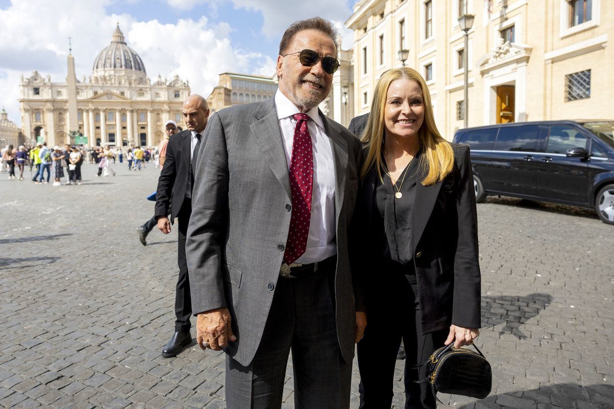 Arnold Schwarzenegger and his girlfriend Heather Milligan pose in St. Peter's Square