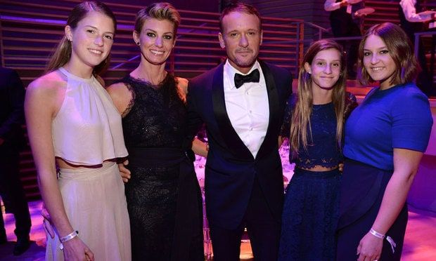 Tim, with wife Faith to his right, is protective of his daughters (from left to right) Maggie, Audrey and Gracie.
Photo: Kevin Mazur/Getty Images for TIME