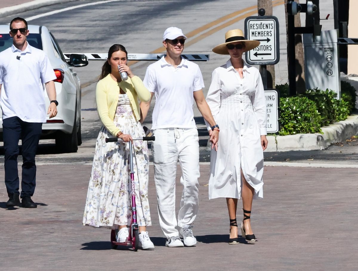 Jared kept things casual and clean in a white polo shirt, light-colored pants, gray sneakers, and a white baseball cap, coordinating seamlessly with the family’s crisp, monochromatic palette.