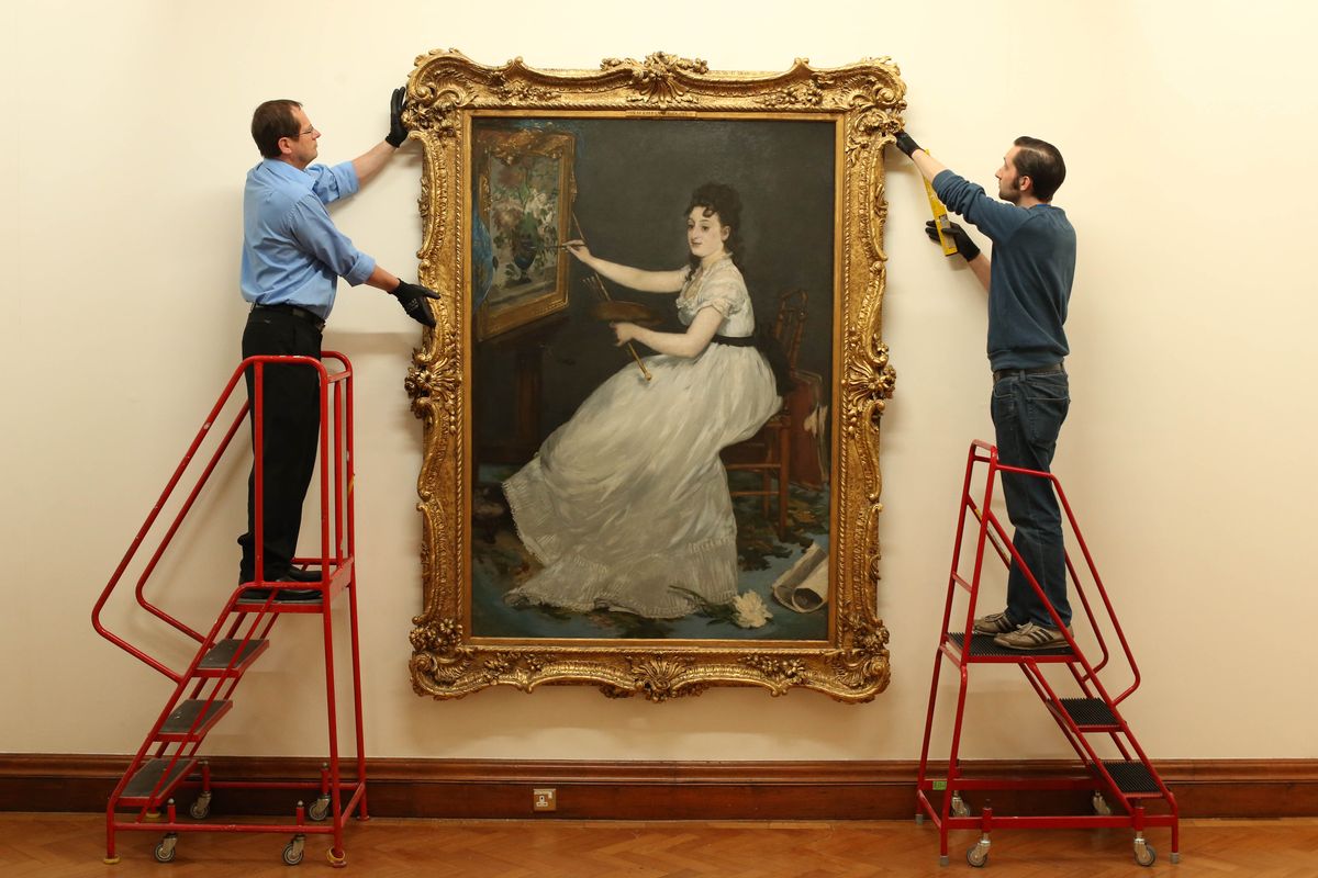 A portrait of Éva Gonzalès by Édouard Manet is carefully installed at a gallery. Monaco’s Princely Collections hold around 10 works by Gonzalès, making Prince Albert an important lender to the new Paris exhibition.