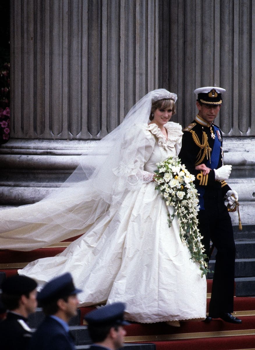 Prince Charles, Prince of Wales and Diana, Princess of Wales, wearing a wedding dress designed by David and Elizabeth Emanuel and the Spencer family Tiara, leave St. Paul's Cathedral following their wedding