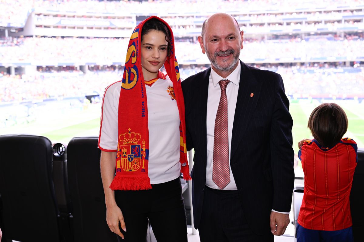 Rosalía celebrated from the stands with a Spanish national team scarf wrapped around her head.