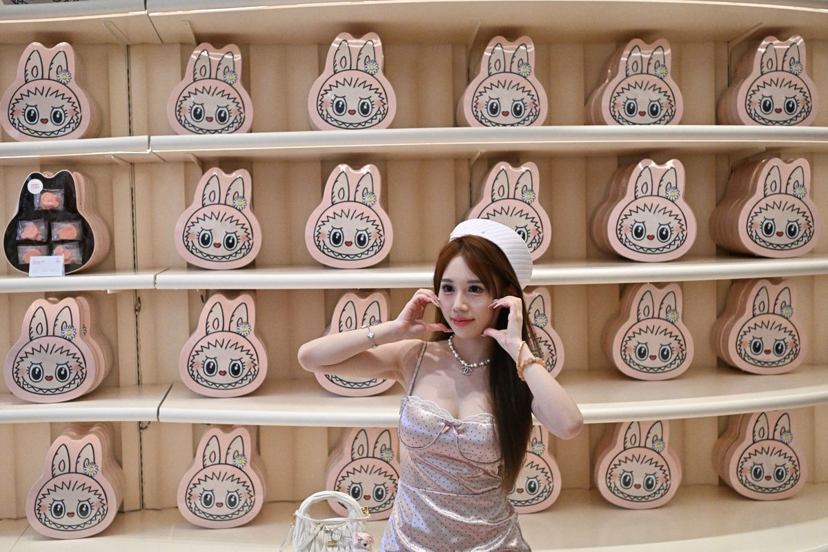 A picture-perfect moment with boxes of Mokokos on display at Pop Land in Beijing - a.k.a. Labubu Land!