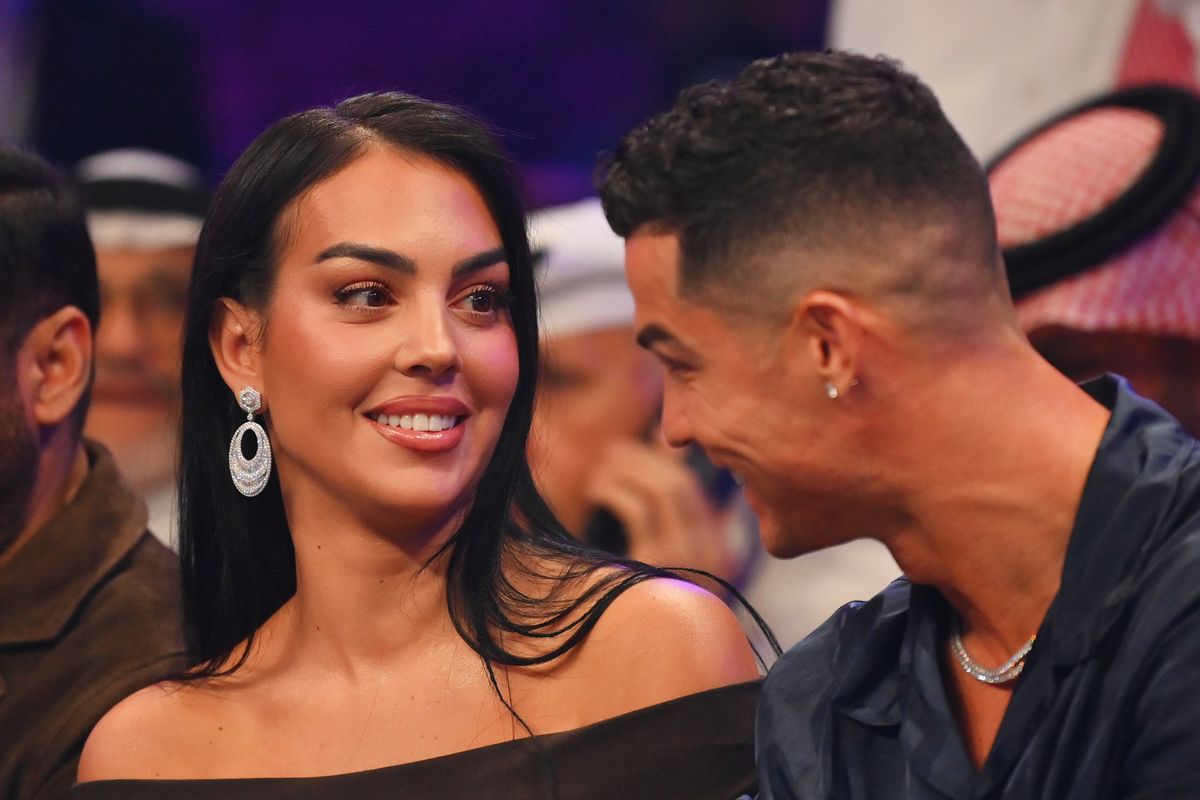 Cristiano Ronaldo and his wife Georgina RodrÃ­guez speak ringside prior to the Heavyweight fight between Tyson Fury and Francis Ngannou at Boulevard Hall on October 28, 2023 in Riyadh, Saudi Arabia. (Photo by Justin Setterfield/Getty Images)