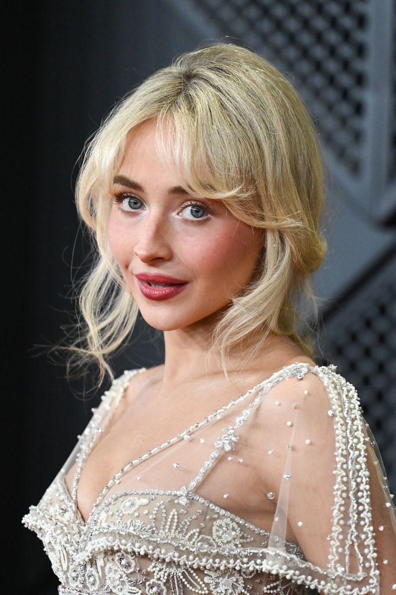 Sabrina Carpenter poses in sheer beaded gown with floral bodice at 2026 Grammys Sabrina Carpenter poses in sheer beaded gown with floral bodice at 2026 Grammys