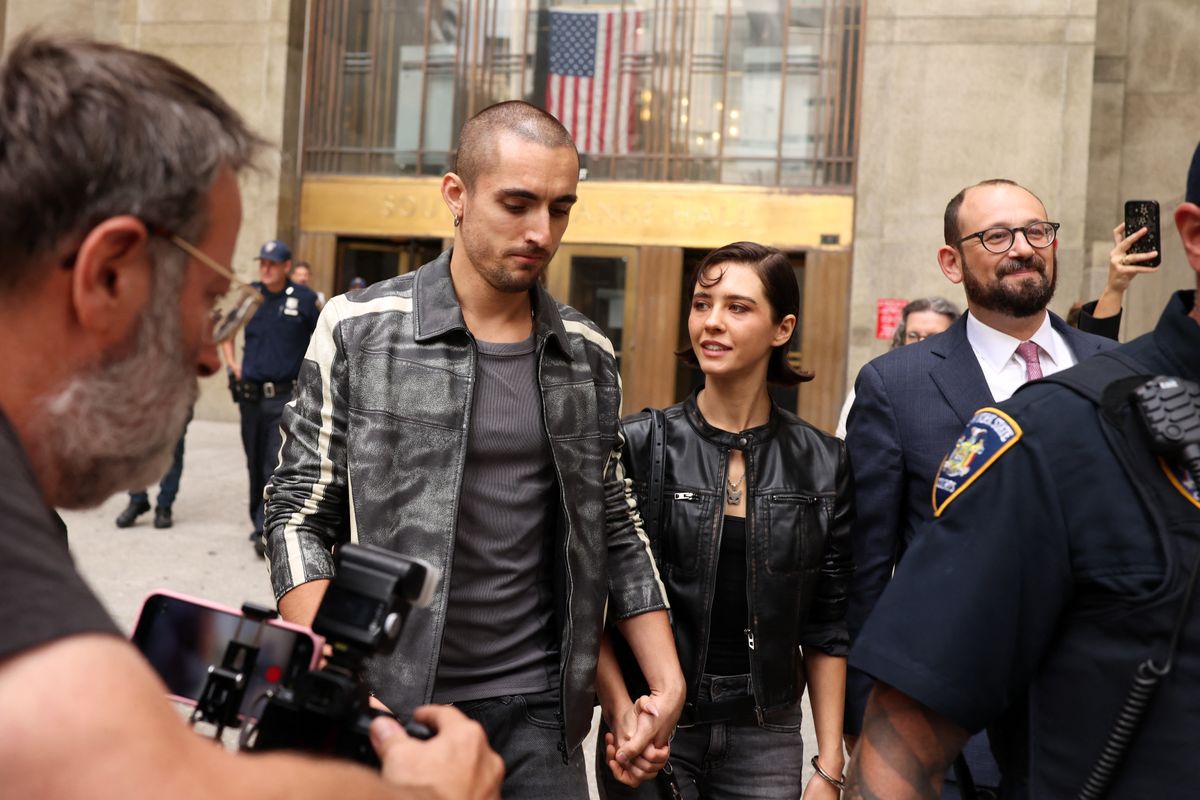 Empire State Building daredevils Ivan Beerkus and Angela Nikolau share a steamy moment at court