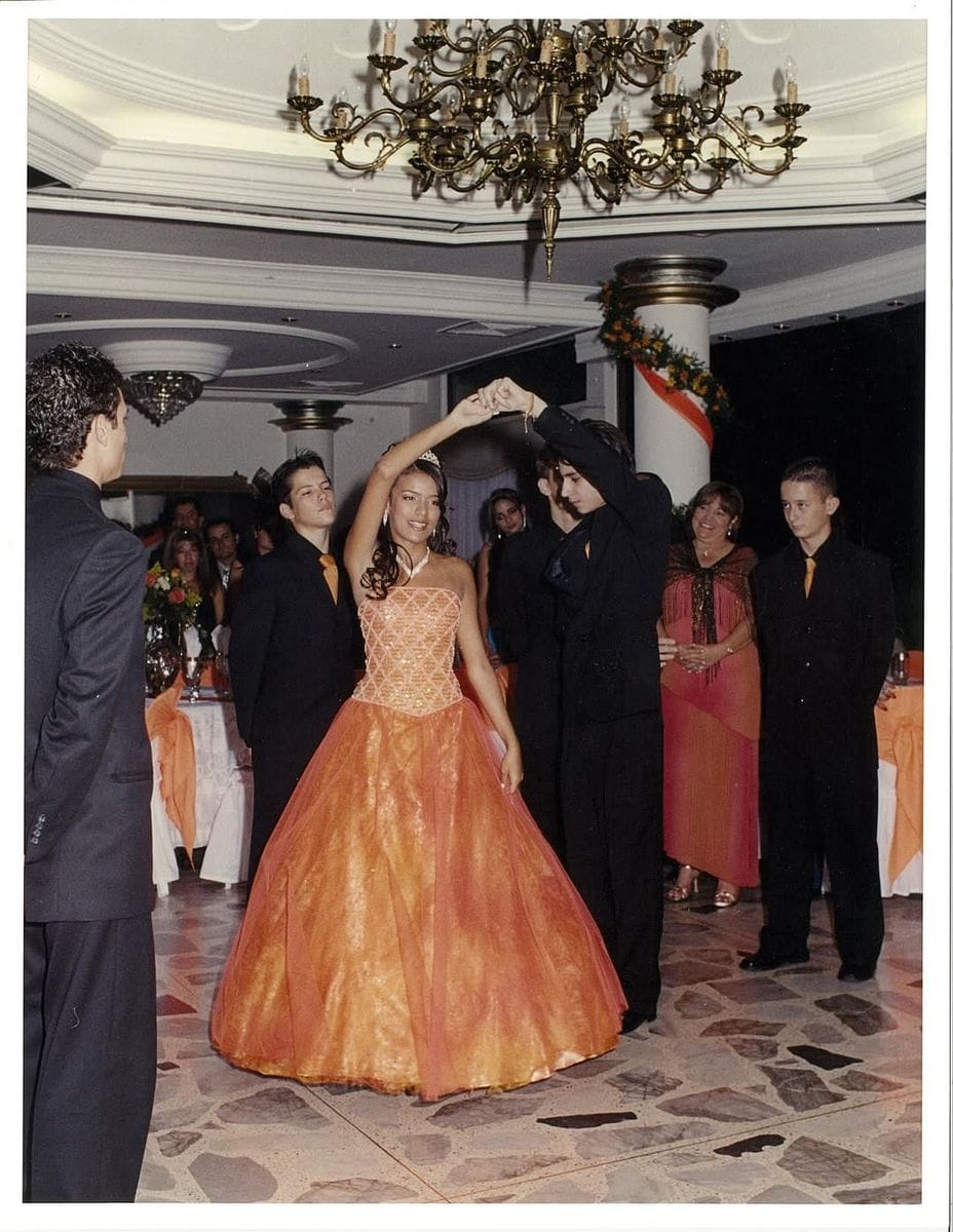 Karol G dances with one of her chambelanas 