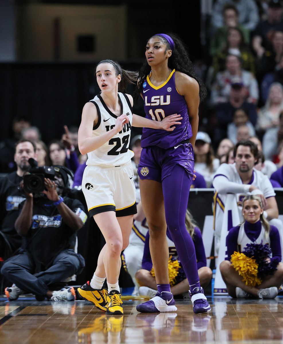 Caitlin Clark #22 of the Iowa Hawkeyes and Angel Reese #10 of the LSU Tigers during the finals of the NCAA Women's Basketball Tournament - Albany Regional at MVP Arena on April 01, 2024 in Albany, New York. (Photo by Andy Lyons/Getty Images)