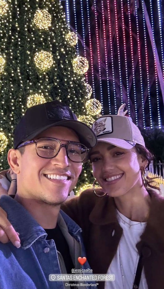 In the holiday photo, Alba wrapped her arm around Ramirez as they leaned into the seasonal cheer.