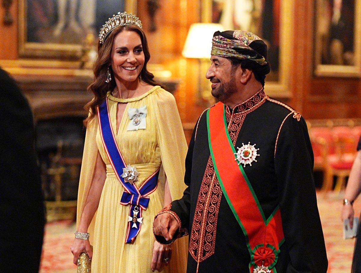 Catherine, Princess of Wales and H.E. Sayyid Khalid Hilal Al Busaidy walk in procession to the state banquet for the Sultan of Oman