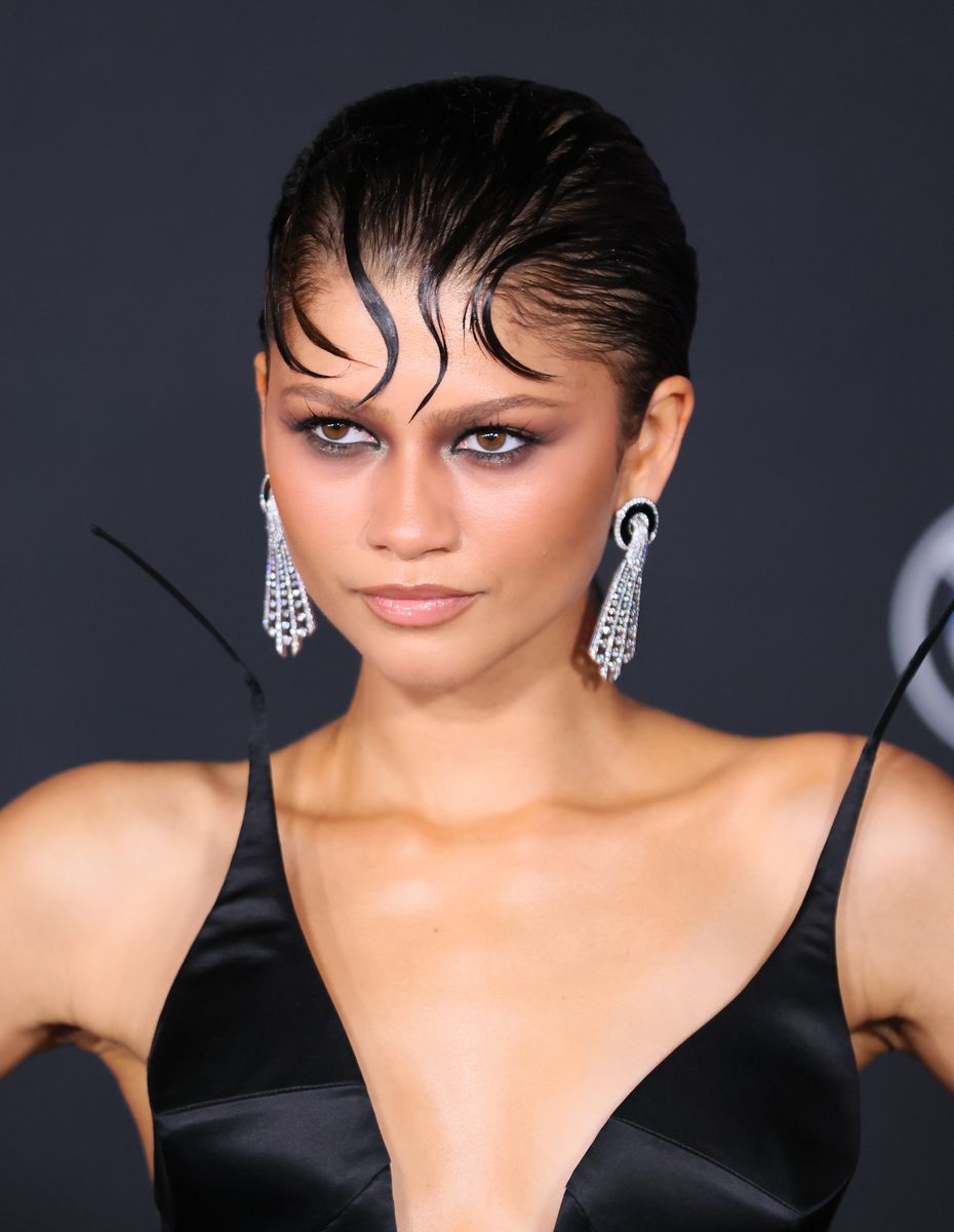 Beauty fans immediately nicknamed the style "Spider Bangs" because the carefully molded strands resembled spider legs stretching across her hairline.