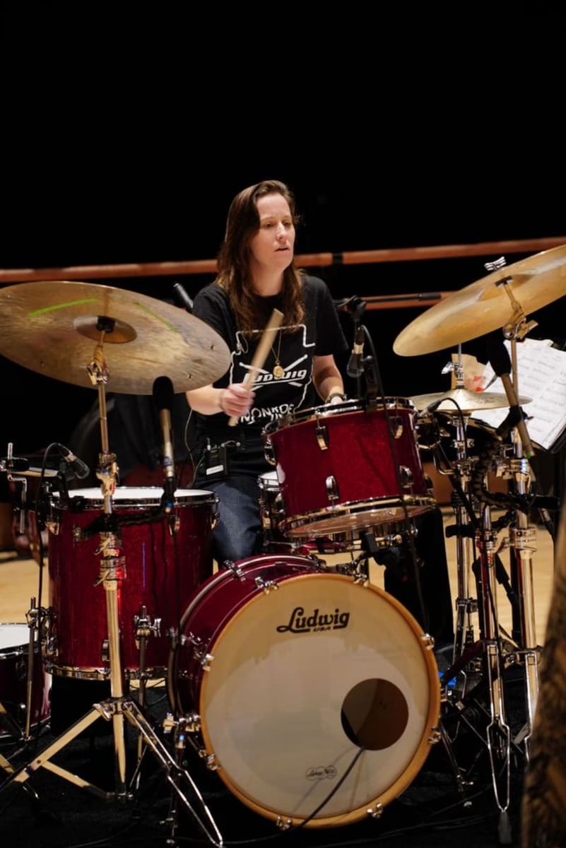 The band consists of 20 musicians, with Colleen Clark Acosta serving as the musical director.