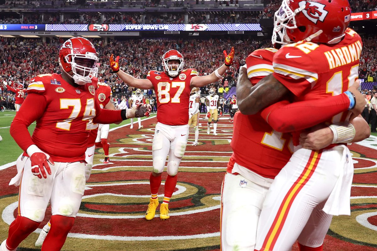 LAS VEGAS, NEVADA - FEBRUARY 11: Mecole Hardman Jr. #12 of the Kansas City Chiefs celebrates with Patrick Mahomes #15 and Travis Kelce #87 and teammates after catching the game-winning touchdown pass to defeat the San Francisco 49ers 25-22 during Super Bowl LVIII at Allegiant Stadium on February 11, 2024 in Las Vegas, Nevada. (Photo by Ezra Shaw/Getty Images) 