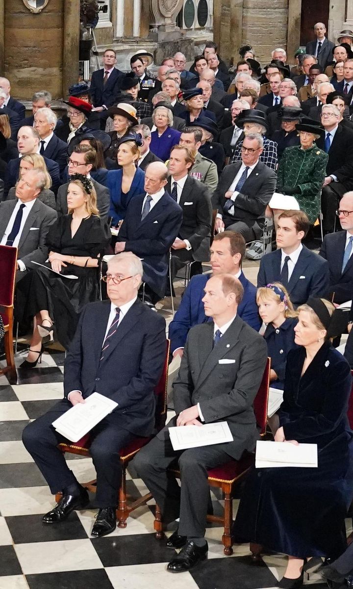 Isla was caught resting on her dad Peter's arm during the Service of Thanksgiving.