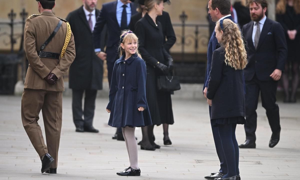 Isla, pictured staring back at her big sister, turned 10 on the day of the memorial service for her late great-grandfather (March 29).
