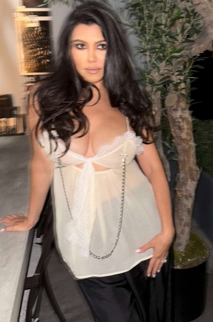 Kourtney wore what appeared to be either nipple clamps or faux nipple piercings, connected by a shiny silver chain
