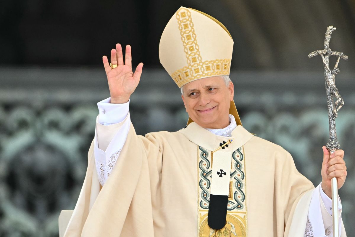   Pope Leo XIV waves after delivering the Regina Caeli prayer after a Holy Mass for the Beginning of his Pontificate, in St Peter's square in The Vatican on May 18, 2025. (Photo by Alberto PIZZOLI / AFP) (Photo by ALBERTO PIZZOLI/AFP via Getty Images)        