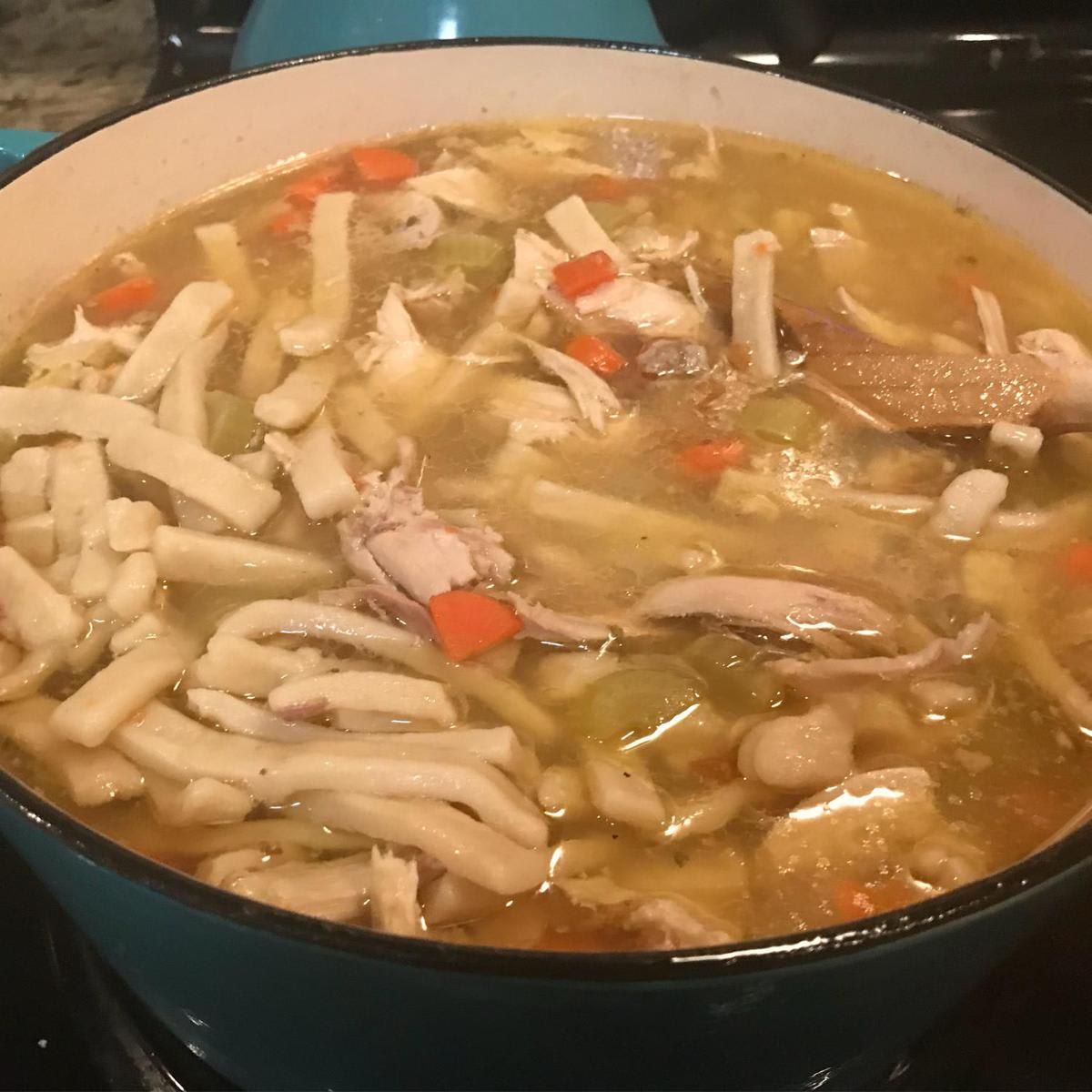 Homemade chicken soup on the stove top
