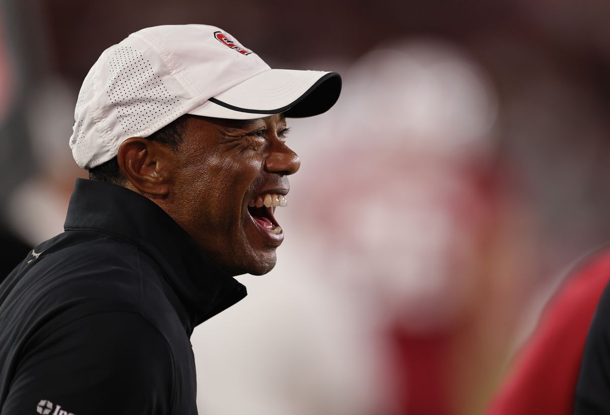 Tiger Woods smiles on the field during the game between Miami Hurricanes and Stanford at Stanford Stadium on September 4, 2026