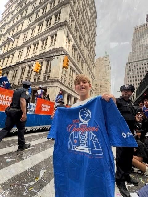 Theo celebrates the New York Knicks' big moment with courtside excitement and plenty of team spirit.