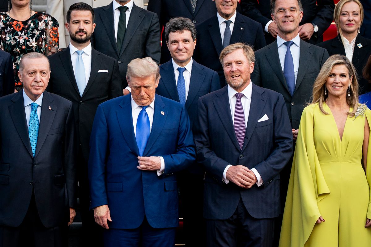 Máxima appeared in a lime-green silk jumpsuit by Natan.