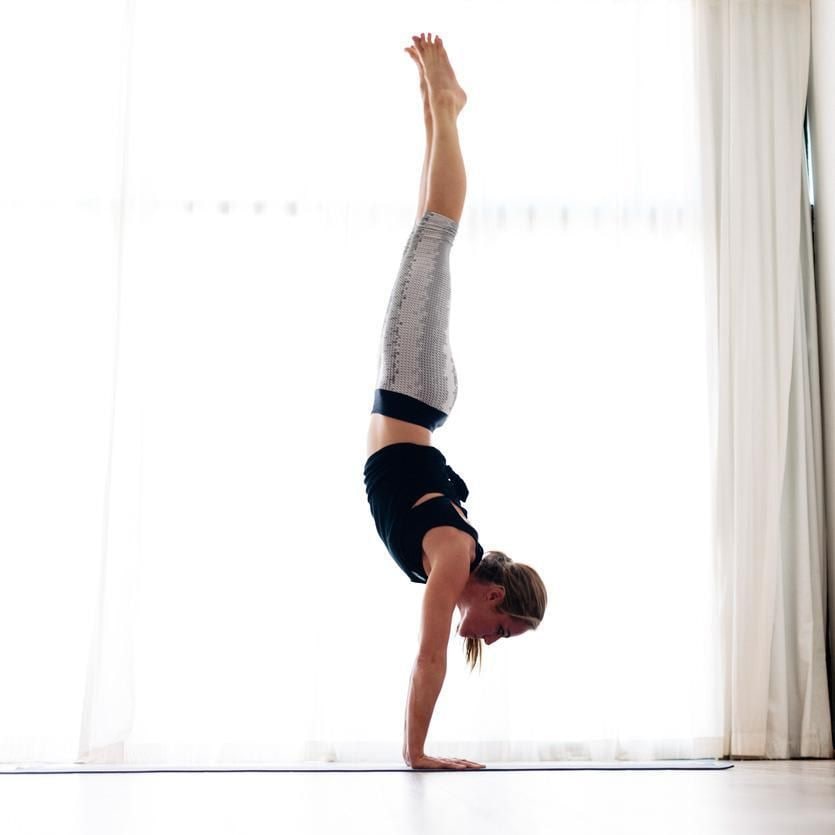 Woman doing a handstandn