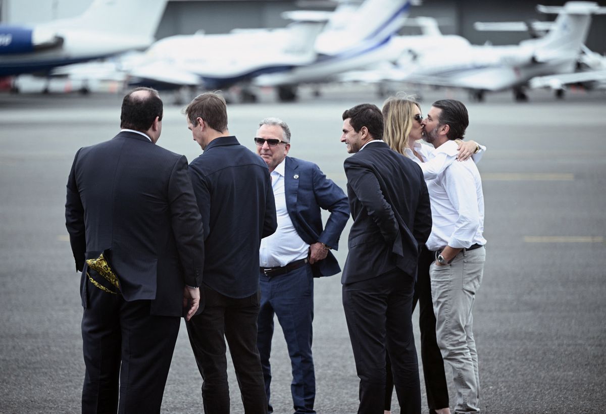 Donald Trump Jr. kisses his girlfriend Bettina Anderson next to his brother-in-law Michael Boulos, US special envoy to the Middle East Steve Witkoff, Jared Kushner and special personal senior counsel to the president Boris Epshteyn.
