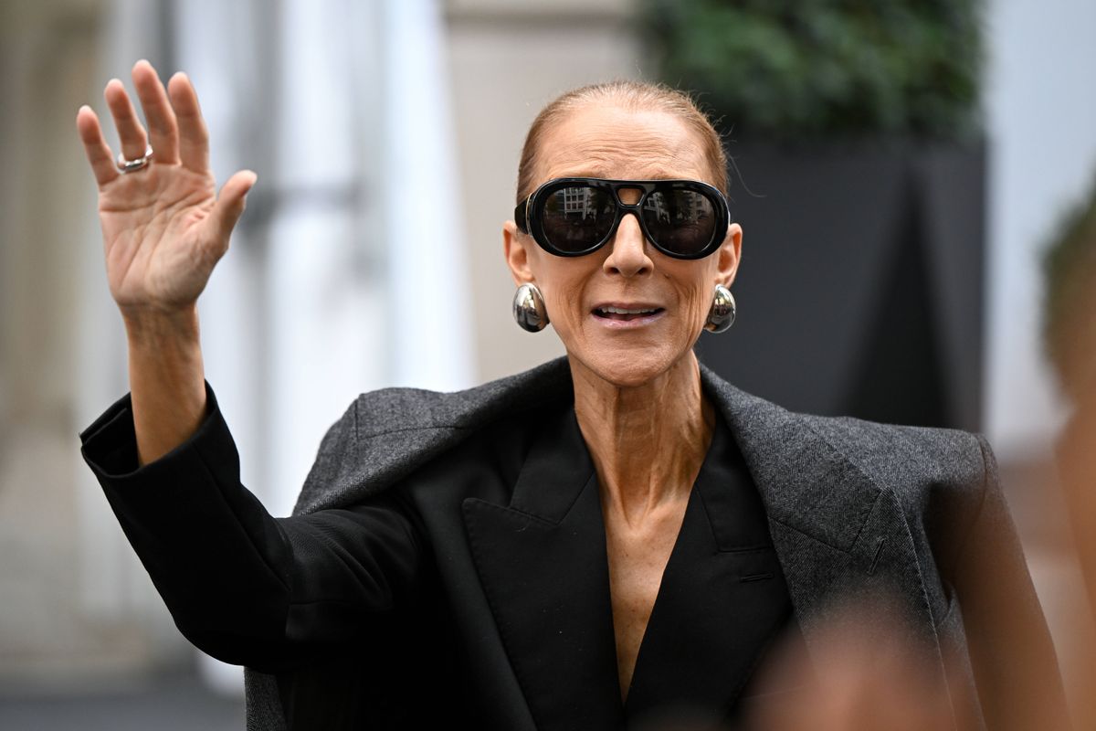 Céline waved to the crowd in oversized Givenchy sunglasses, statement silver earrings and a sleek low bun.