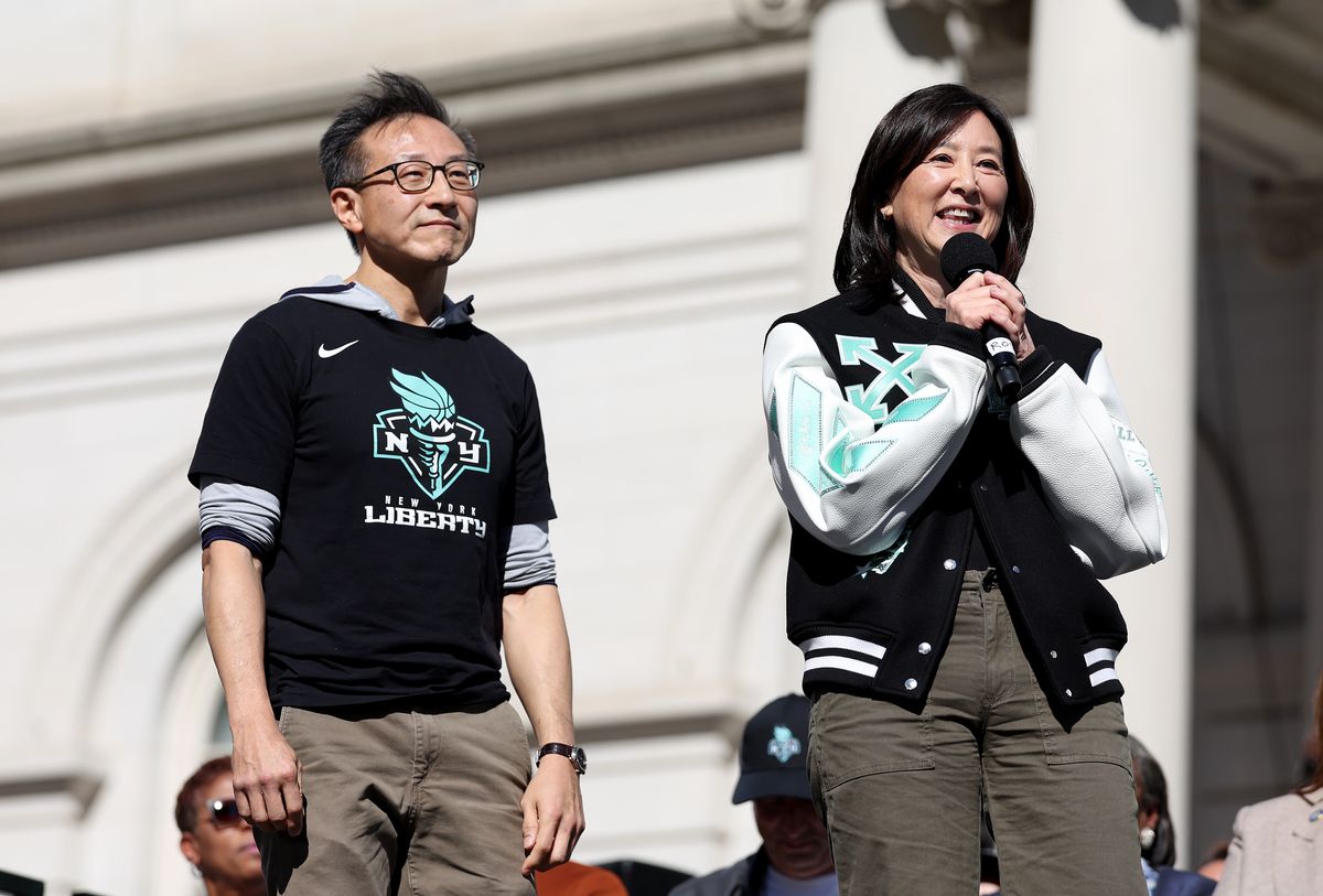 New York Liberty owners Clara Wu Tsai and Joseph Tsai address the fans during the Championship ticker tape parade 