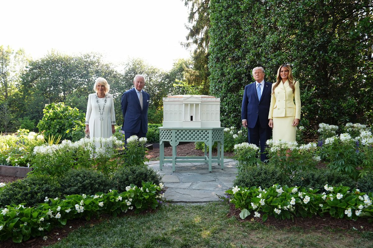 US President Donald Trump, First Lady Melania Trump, Britain's King Charles III, and Britain's Queen Camilla tour the White House beehive.