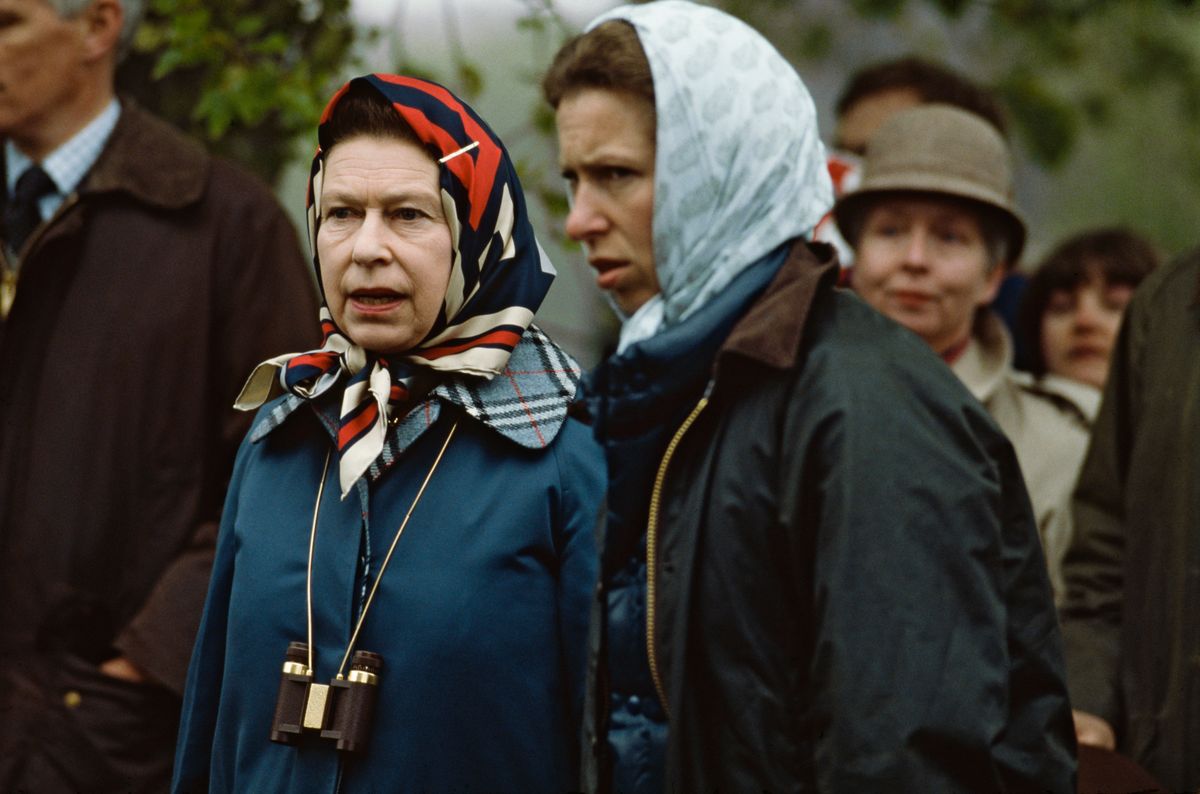Queen Elizabeth II (left) and her daughter, Princess Anne, watching Anne's children, Zara and Peter, take part in the Equestrian Grand Prize at Windsor, May 1985. 