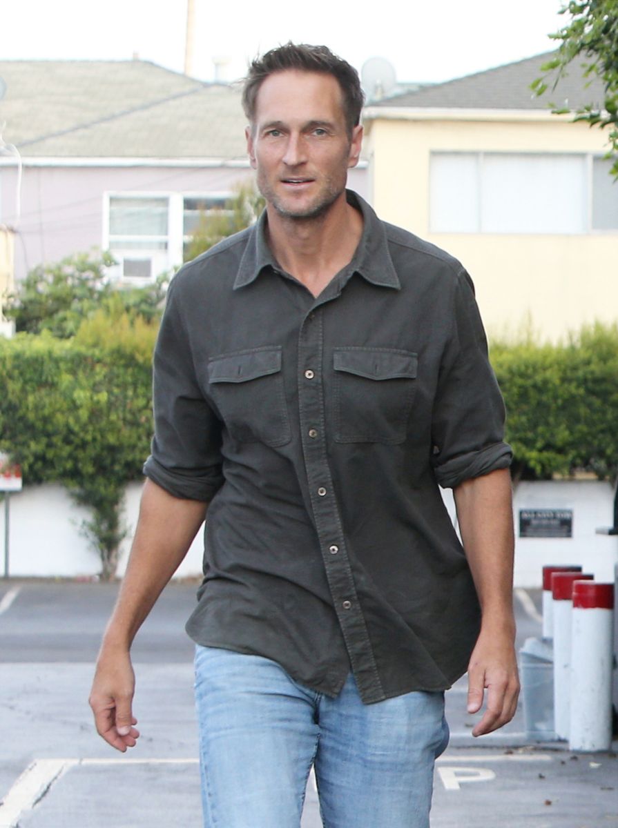 John Miller opted for a charcoal button-down, light-wash jeans and brown boots for the couple’s relaxed Santa Monica outing.