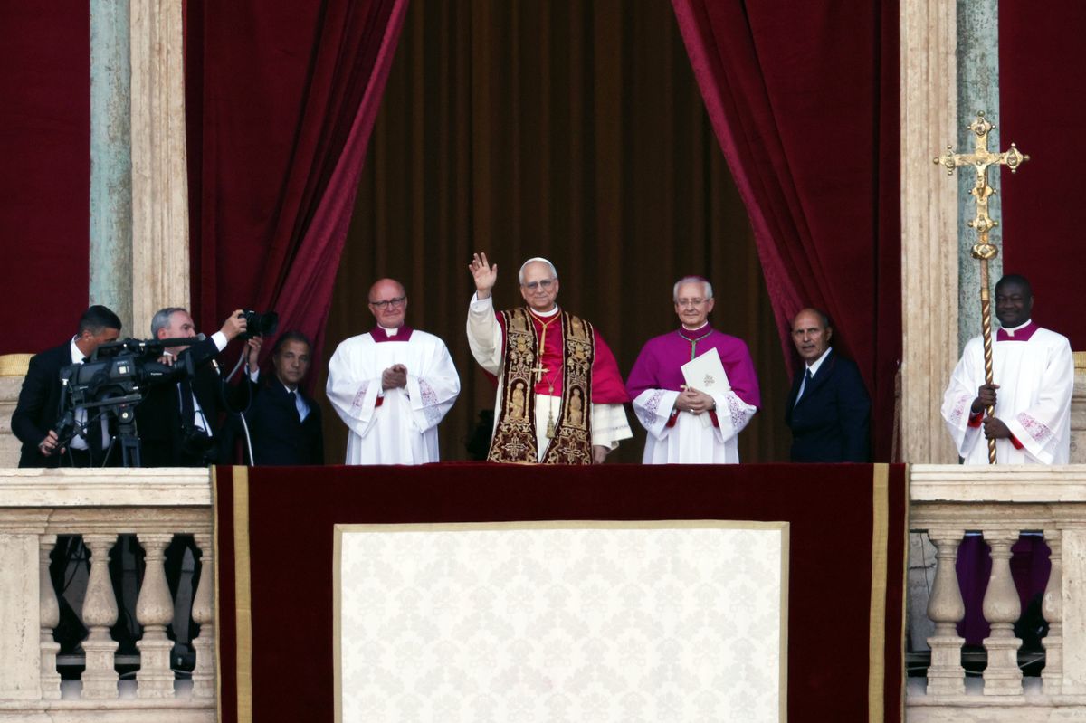 VATICAN CITY, VATICAN - MAY 8: The newly elected Pontiff, Pope Leo XIV is seen for the first time from the Vatican balcony on May 8, 2025 in Vatican City, Vatican. Cardinal Robert Prevost will be known as Pope Leo XIV. White smoke was seen over the Vatican early this evening as the Conclave of Cardinals took just two days to elect the new Pontiff after the death of Pope Francis on Easter Monday. (Photo by Dan Kitwood/Getty Images)