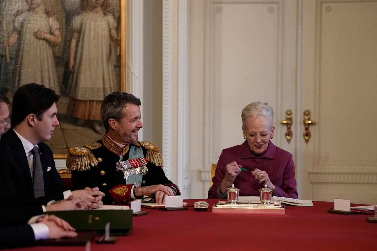 Queen Margrethe II of Denmark signs a declaration of abdication as Crown Prince Frederik of Denmark becomes King Frederik X of Denmark and Prince Christian of Denmark reacts in the Council of State at the Christiansborg Castle in Copenhagen, Denmark, on January 14, 2024.