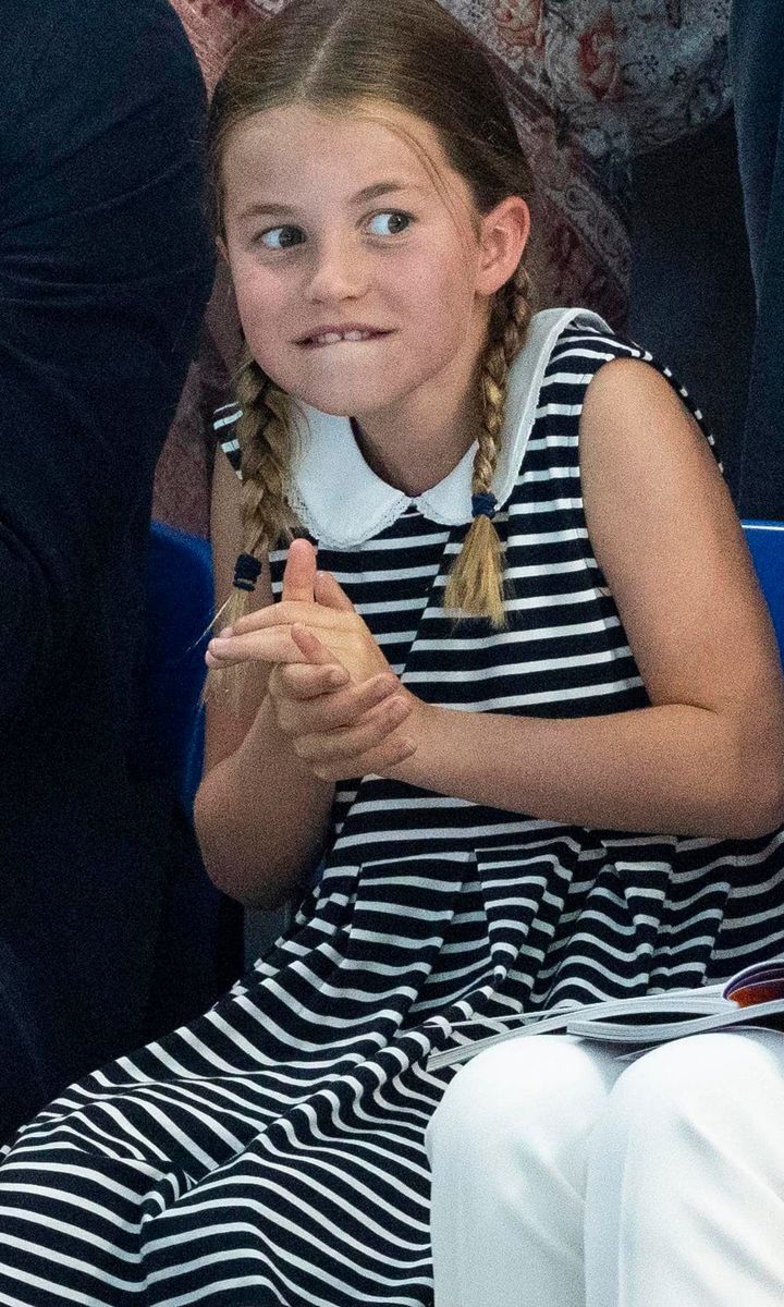 The Duke and Duchess' daughter was animated as she watched swimmers.