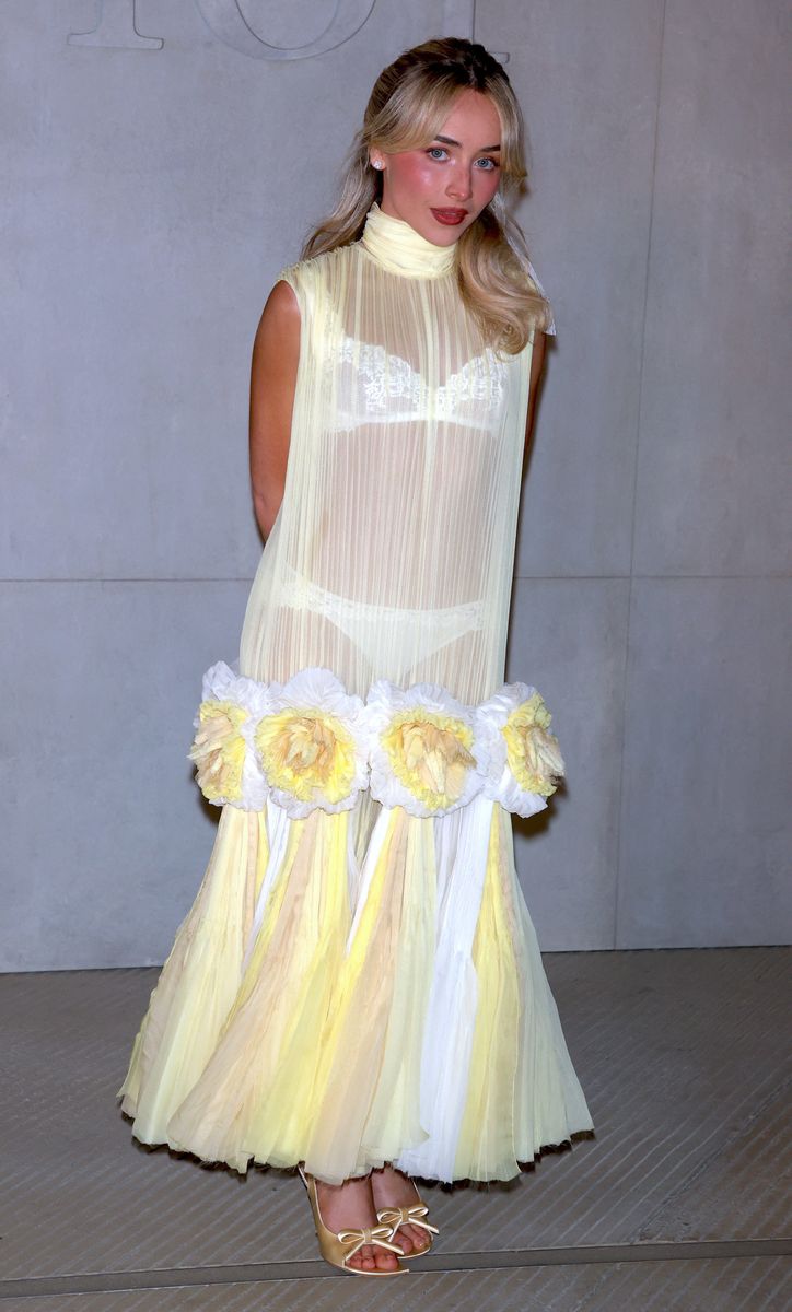 Carpenter completed the look with satin butter yellow heels featuring bow accents and a matching mini handbag decorated with floral details that echoed the dress.