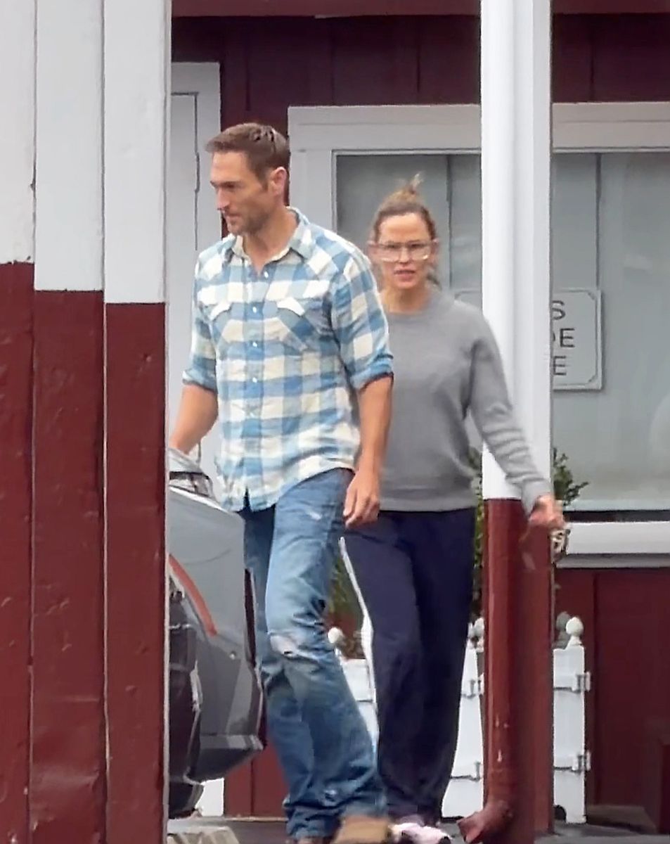 Jennifer Garner and John Miller share a romantic embrace during a rainy Labor Day weekend outing in Brentwood, offering a rare glimpse at the couple