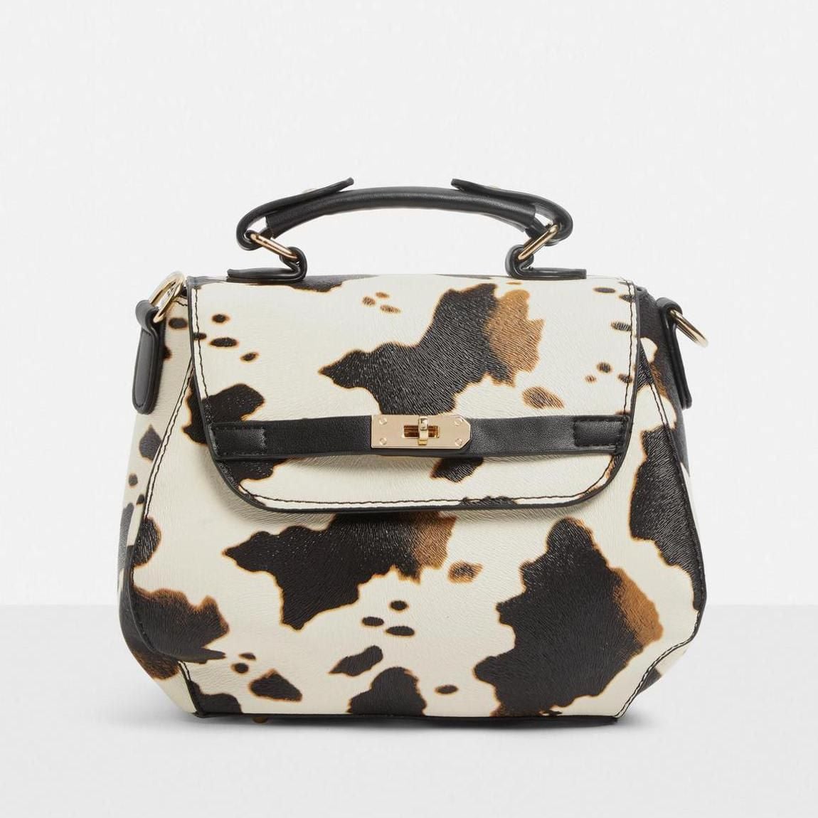 Top handle con cow print de Missguided