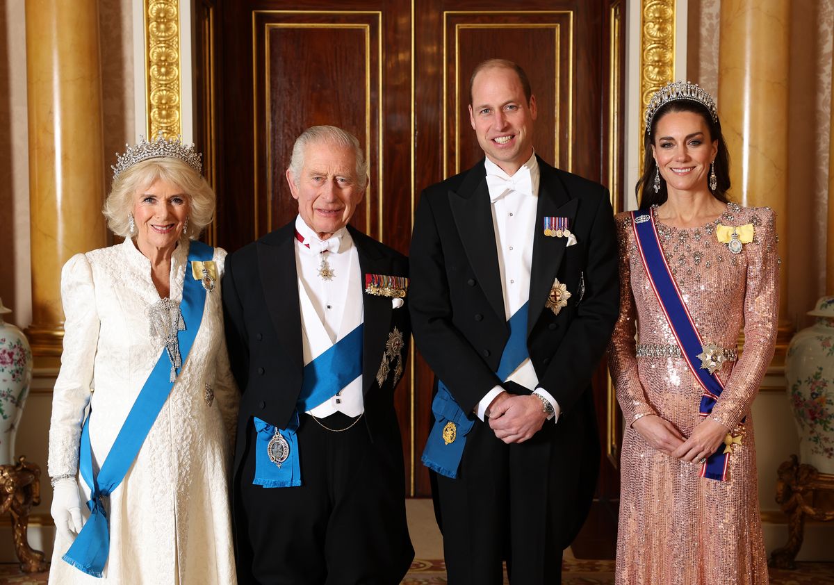 LONDON, ENGLAND - DECEMBER 05: (EDITORIAL USE ON (L-R) Queen Camilla, King Charles III, Prince William, Prince of Wales and Catherine, Princess of Wales pose for a photograph ahead of The Diplomatic Reception in the 1844 Room at Buckingham Palace on December 05, 2023 in London, England. (Photo by Chris Jackson/Getty Images For Buckingham Palace)