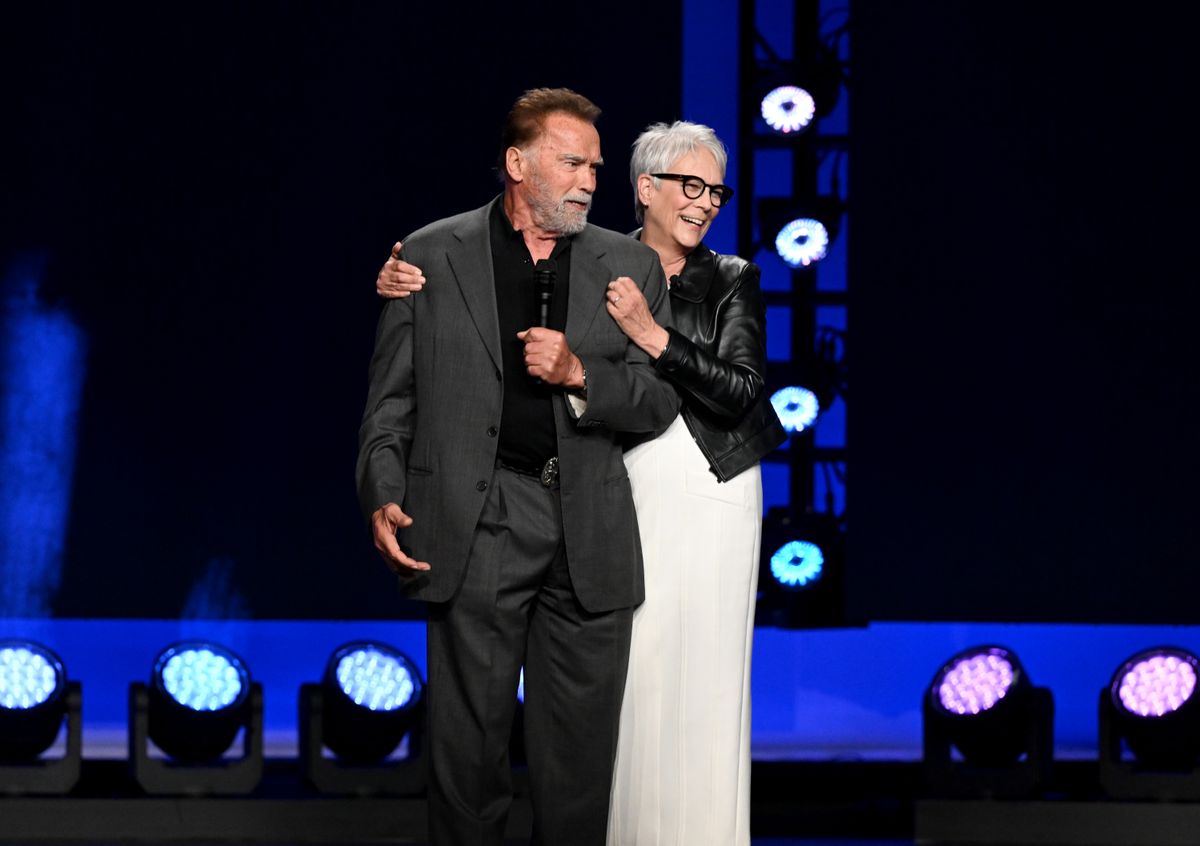 Jamie Lee Curtis playfully pulled Schwarzenegger off the stage