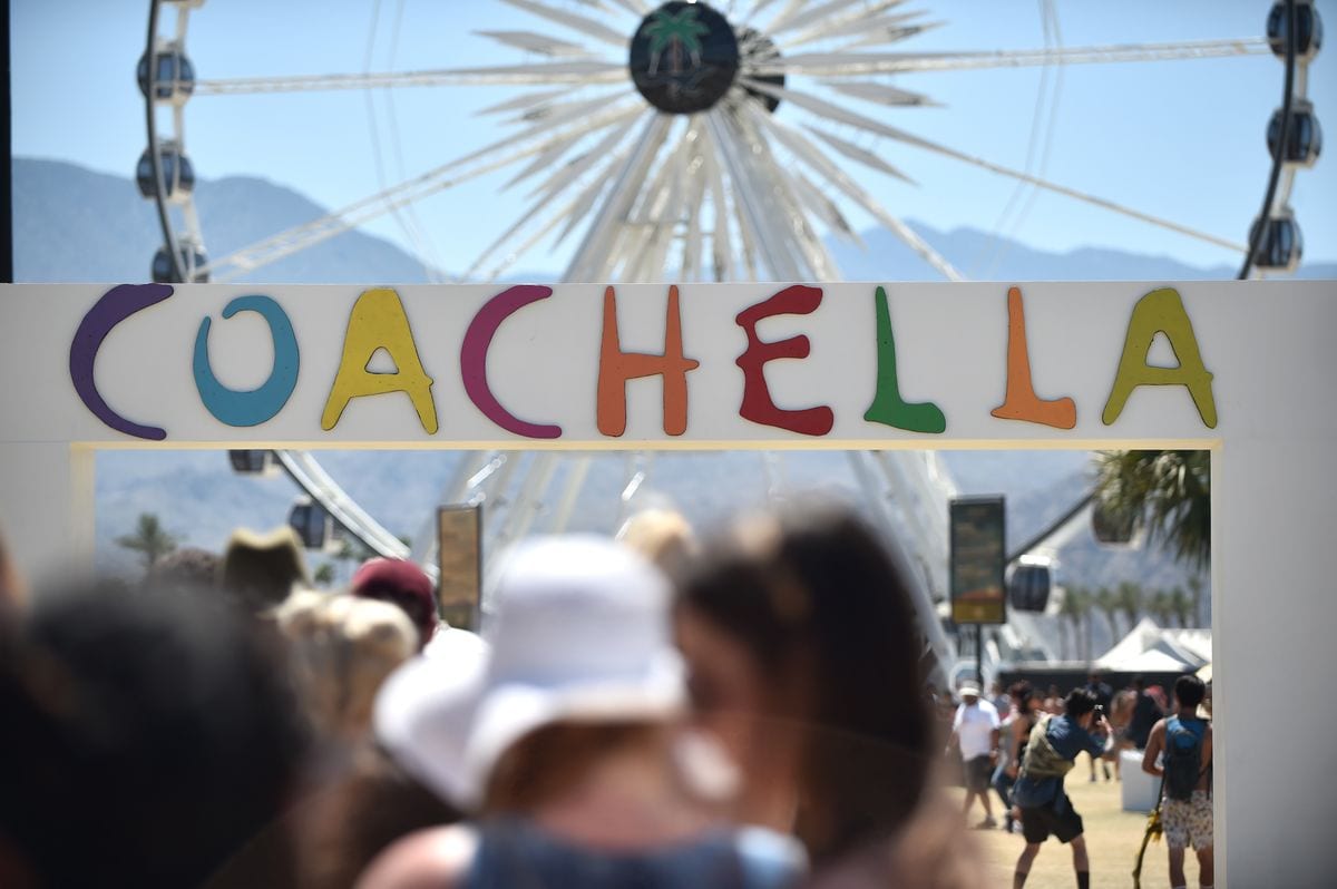 INDIO, CA - APRIL 23:  Festivalgoers are seen near the Ferris Wheel during day 3 of the Coachella Valley Music And Arts Festival  (Photo by Emma McIntyre/Getty Images for Coachella) 
