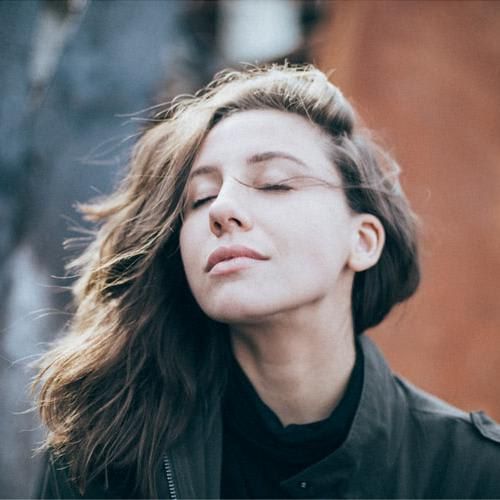 close-up of woman deep in thought